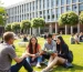 International students socializing on a Spanish university campus with modern facilities